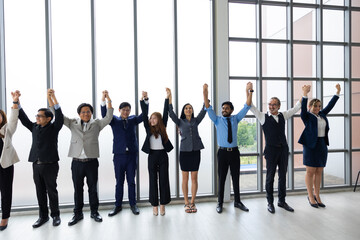 happy business team making high hands up for business teamwork celebrating. business team celebrating success and having fun