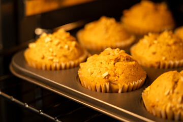 Freshly baked homemade muffins rising to golden perfection in the oven – ideal for breakfast, snacks, or dessert with an irresistible aroma straight from your kitchen