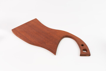 Angle view at approximately a 45-degree angle of a butcher knife-shaped cutting board made from Borneo ironwood, isolated on a white background