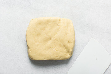 overhead view of vanilla sugar cookie dough on granite countertop, top view of plain cookie dough, process of making sugar cookies