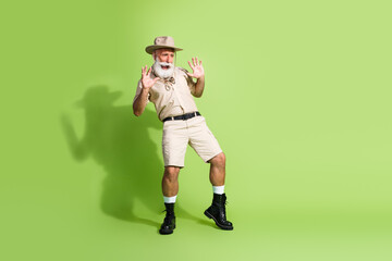 Photo of panic senior traveler screaming look down empty space wild danger isolated reen color background