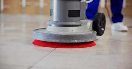 Janitor, feet and polishing machine on floor for cleaning tiles, office maintenance and hygiene....