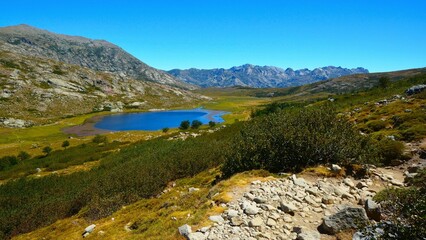 Fototapeta premium Lac de Nino - a lake on the Tavignano river near to its source below Bocca a Reta, the river flows through marshy land above and below the lake (GR 20 hiking trail, Haute-Corse department, Corsica)