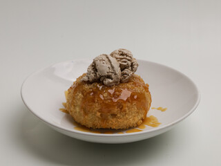 Fried ice cream with caramel sauce and caramel ice cream on top