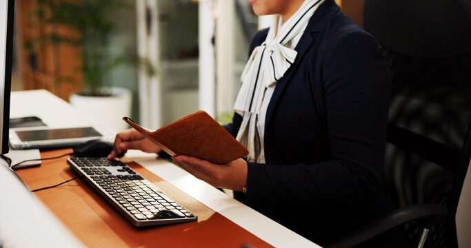 Receptionist, hands or computer with passport at hotel for check in, reservation or online booking. Hospitality industry, concierge typing and woman with personal info for accommodation confirmation