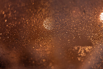 Blurred background with raindrops and lights.