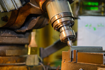 The chamfering process on NC milling machine with chamfer tools in the light blue scene.