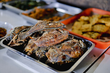 Fried fish served at a buffet restaurant.