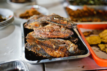 Fried fish served at a buffet restaurant.