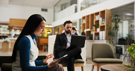 Hotel, guest and woman with tablet, hospitality and preparation for meeting with tech, web or lobby. Checking, email and people with app for research, online and accountant on business trip in motel