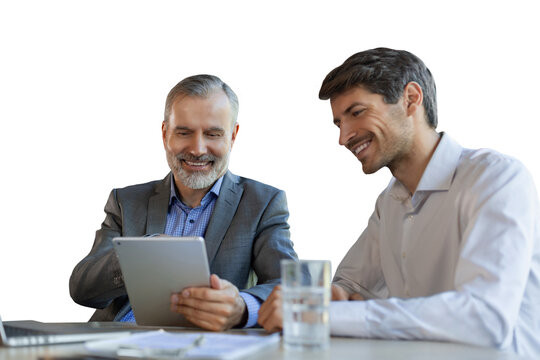 Mature businessman using a digital tablet to discuss information with a younger colleague on a transparent background