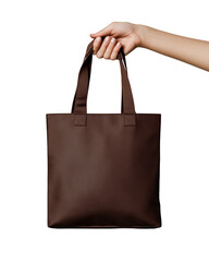 A hand is holding a brown bag. The bag is made of leather and has a brown color
