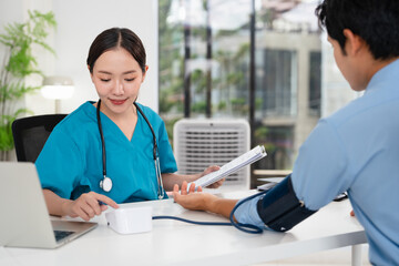 Blood pressure, man and doctor in office with discussion, help and advice for hypertension. Clinic,...