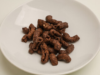 Chocolate crunchy snacks on white background