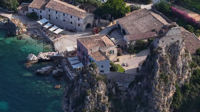 Il mare della Sicilia, Italia. Tonnara di Scopello. 4K
Vista aerea della costa pi&ugrave; bella della Sicilia. La baia di Scopello, tra Palermo e San Vito Lo Capo. Riserva dello Zingaro. 