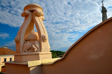 View of the newly built roof on a historic house. New roof covering with a historical element. Concept of house history and construction