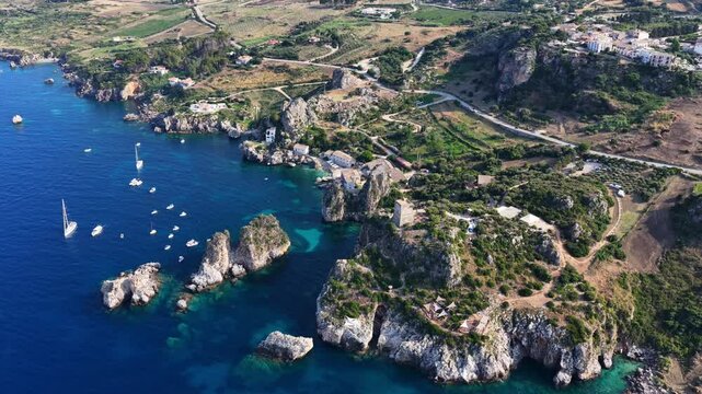 Il mare della Sicilia, Italia. Tonnara di Scopello. 4K
Vista aerea della costa pi&ugrave; bella della Sicilia. La baia di Scopello, tra Palermo e San Vito Lo Capo. Riserva dello Zingaro. 