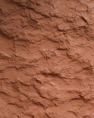 Close-up of Red Clay Wall with Rough Texture and Natural Earthy Colors
