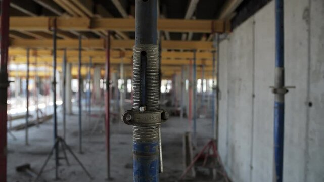 adjustable metal prop at construction site