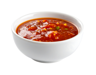 A chunky, vibrant red-orange sauce with visible vegetable pieces, served in a white bowl.