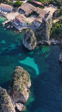 Il mare della Sicilia, Italia. Tonnara di Scopello. 4K
Vista aerea della costa pi&ugrave; bella della Sicilia. La baia di Scopello, tra Palermo e San Vito Lo Capo. Riserva dello Zingaro. 
