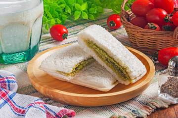 Matcha butter cream with white chocolate chip toast on wooden plate 