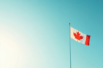 A Canadian flag with a red maple leaf on it is flying in the sky