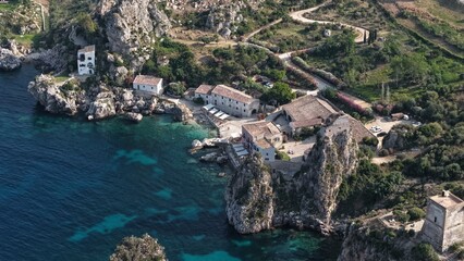 Il mare della Sicilia, Italia. Tonnara di Scopello. 4K
Vista aerea della costa pi&ugrave; bella della Sicilia. La baia di Scopello, tra Palermo e San Vito Lo Capo. Riserva dello Zingaro. 