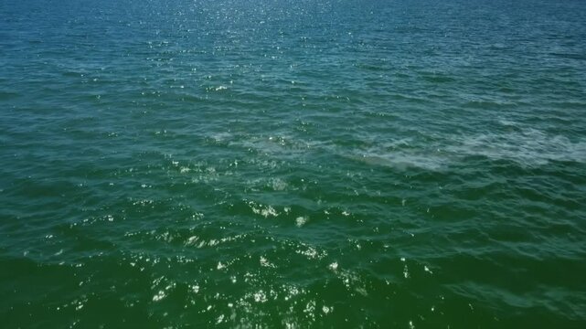 Endless Blue Ocean Surface Loop with Sparkling Light Reflections