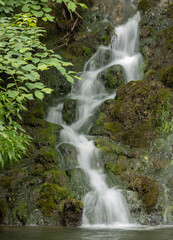 Long exposure shot of a waterfall in the forest.