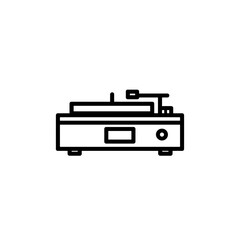 Vintage turntable plays music indoors against plain backdrop