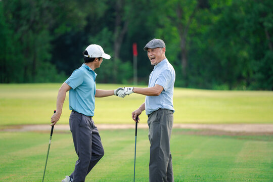 Good shot buddy. Shot of two happy men playing a game of golf. Golf, friends and sport with men on course playing