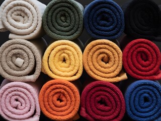 Rolled Terrycloth Towels Various Colors Closeup rolled towels
