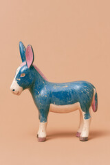 old blue donkey toy with chipped paint, 