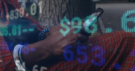 Mature man bringing smartphone into view and tapping screen, generating finance data overlays - Powered by Adobe