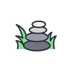 Stacked Stones Symbolizing Tranquility And Harmony Among Green Grass