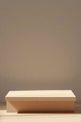 A pale beige rectangular platform sits on a light wood floor against a muted beige wall, illuminated by soft, angled sunlight