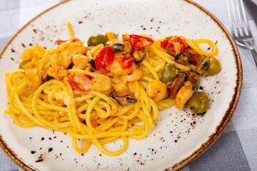Delicious pasta with seafood and cheese served on platter