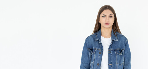 Hmm. Let me think. Studio shot of cute girl looking at camera with thoughtful and sly expression, raising one brow as if having good idea, planning something