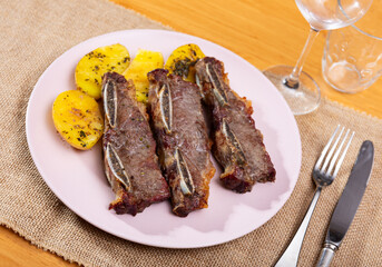 Delicious beef steak with fried potatoes served on plate