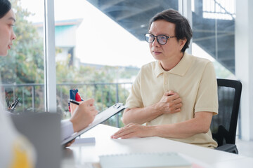 Senior Man Describing Chest Pain to Doctor