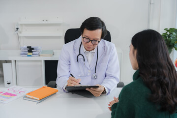 Doctor Consulting with Patient in Office