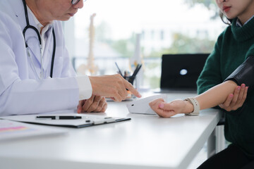 Doctor Checking Patient's Blood Pressure