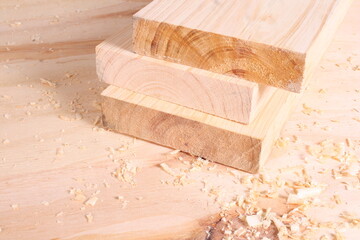 Stack of Freshly Cut Wooden Planks with Wood Shavings