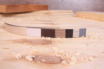 Wood and Material Edging Samples Displayed on a Wooden Board