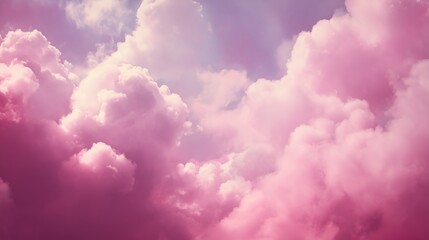 Fototapeta premium Cotton candy skies: Fluffy clouds painted in shades of pink and purple against soft sky