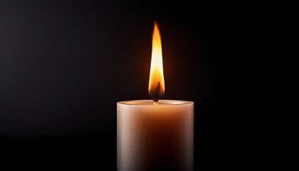 burning candle on a black background