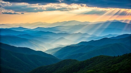 Fototapeta premium Beautiful mountain range with sunlight rays and mist