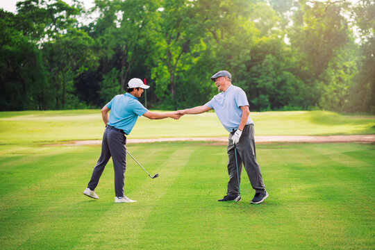Golf Game Between Father and Son Bonding on Green Course With Smile and Connection in Natural Outdoor Setting