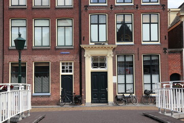 Alkmaar Luttik Oudorp Street View wirh House Facades and Bridge Railing, Netherlands